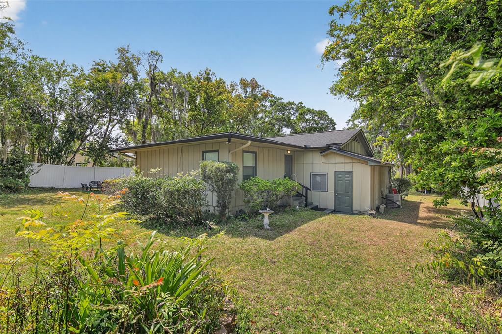 1803 Southeast 3rd Avenue Ocala, FL 34471 - Photo 27 of 29 a view of a house with a yard and potted plants