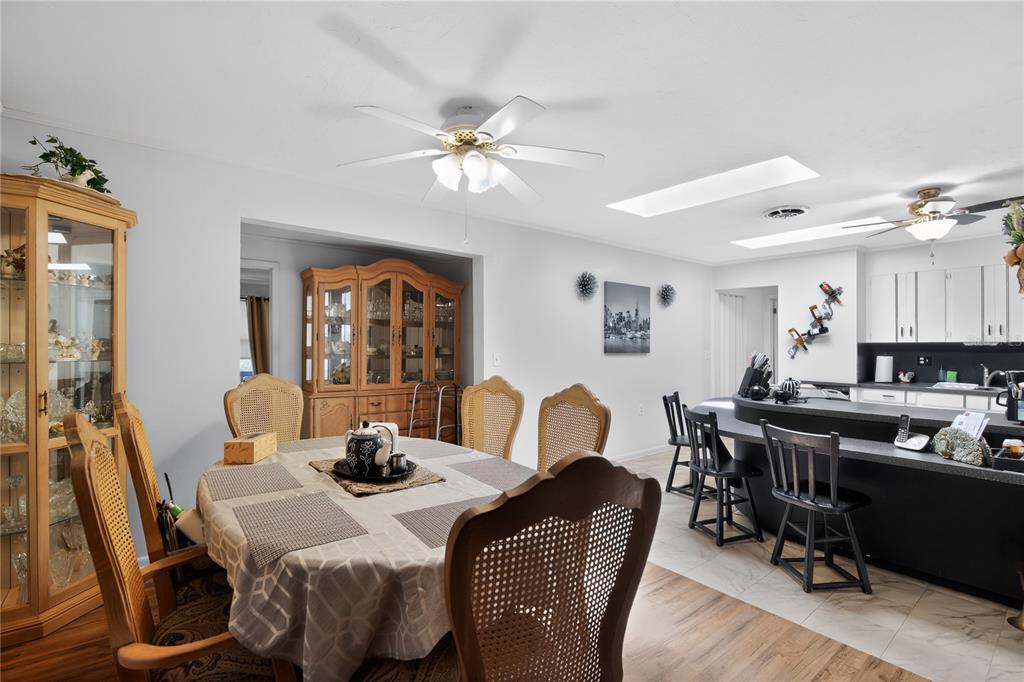 1803 Southeast 3rd Avenue Ocala, FL 34471 - Photo 9 of 29 a view of a dining room with furniture and wooden floor