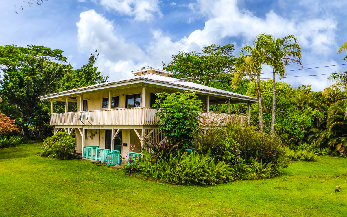 Great curb appeal, wrap lanai, cupola, paved road, mature land scaping and perfect privacy.