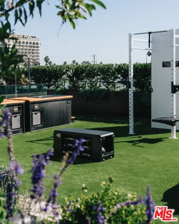a green field with lots of flowers in it