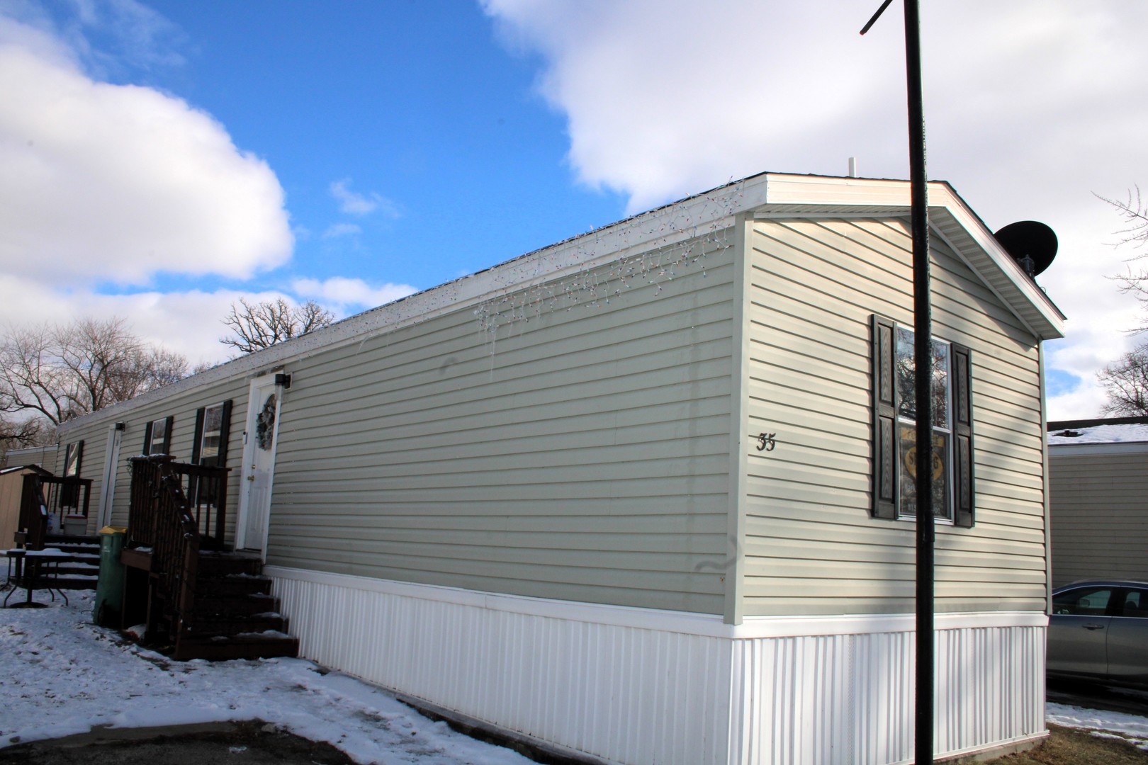 a view of a balcony with furniture and a floor to ceiling window