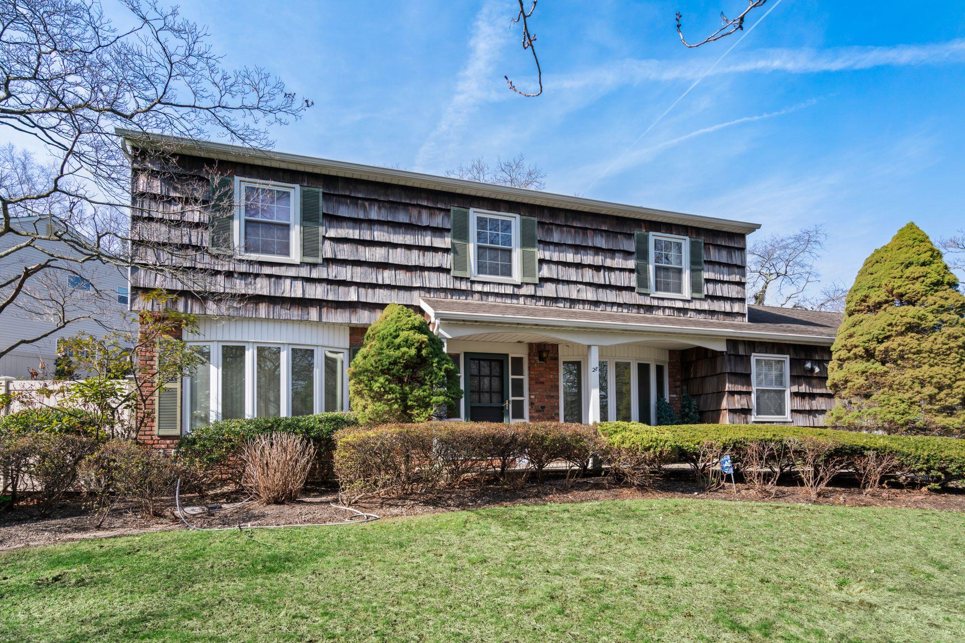 front view of a house with a yard