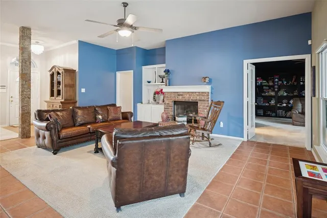 a living room with furniture a table and chairs
