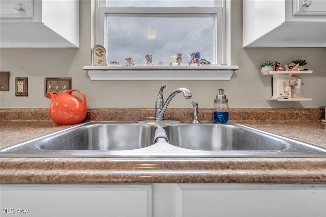 3887 Reeves Lane Medina, OH 44256 - Photo 23 of 42 Room details featuring white cabinets and sink