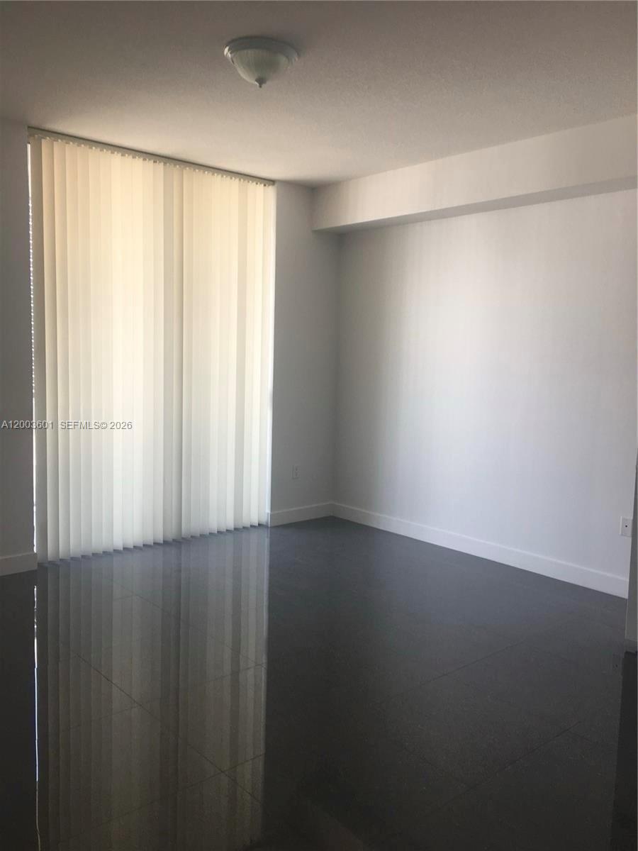 1111 Southwest 1st Avenue, Unit 2223N Miami, FL 33130 - Photo 11 of 39 a view of an empty room with a window