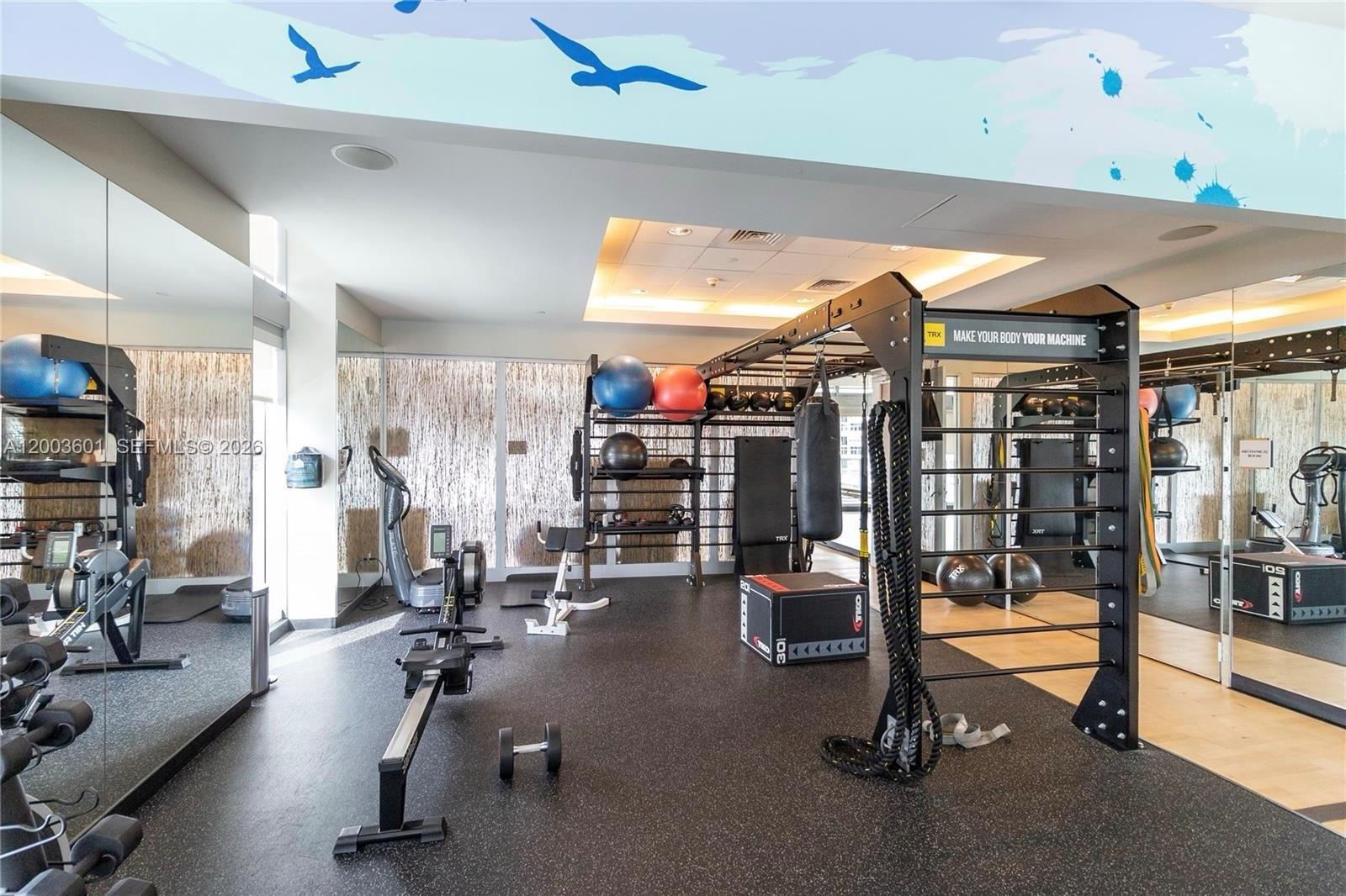 1111 Southwest 1st Avenue, Unit 2223N Miami, FL 33130 - Photo 25 of 39 a view of a room with gym equipment