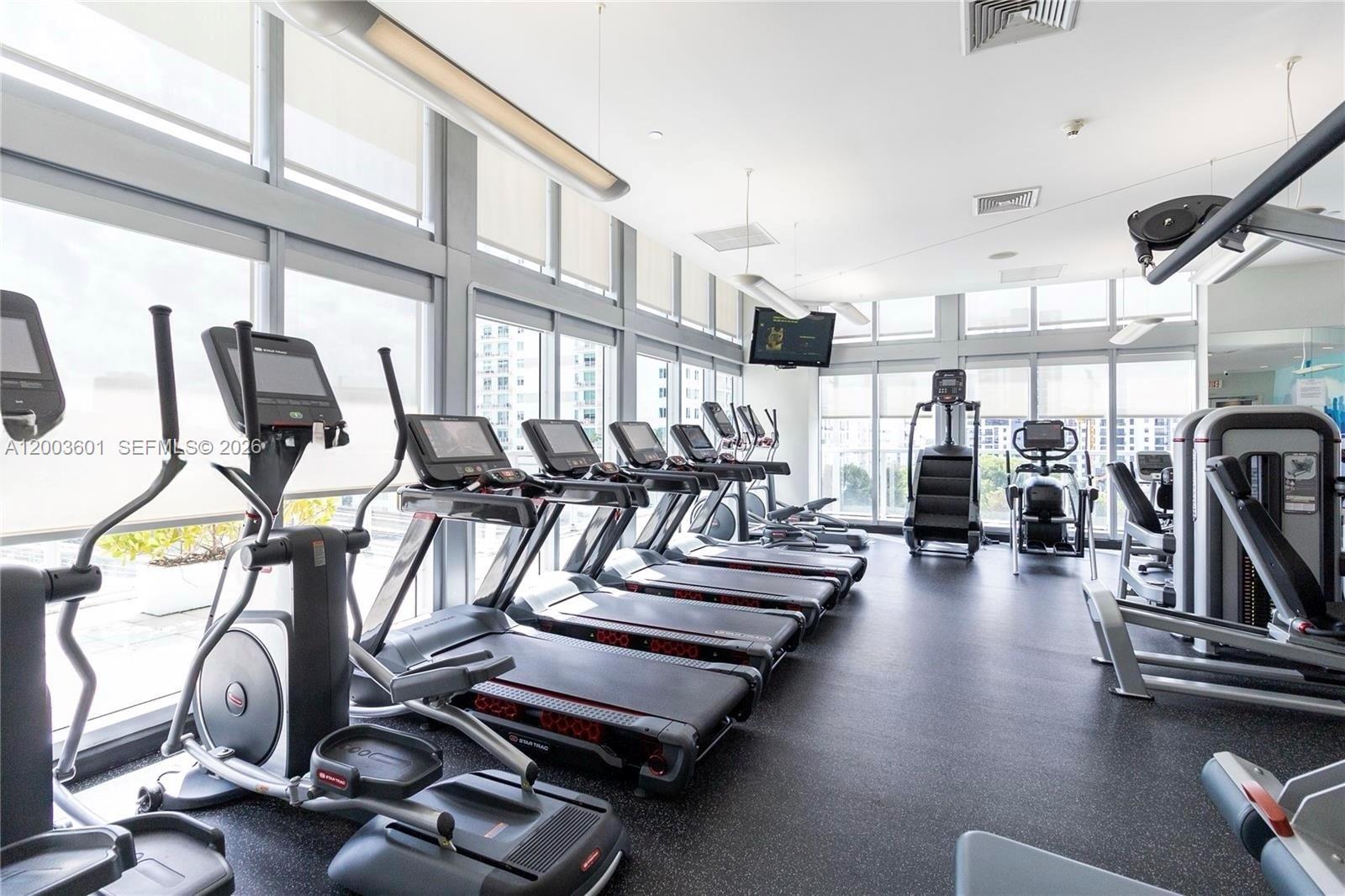 1111 Southwest 1st Avenue, Unit 2223N Miami, FL 33130 - Photo 26 of 39 a view of a room with gym equipment