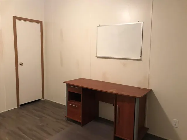 a room with a table and a painting