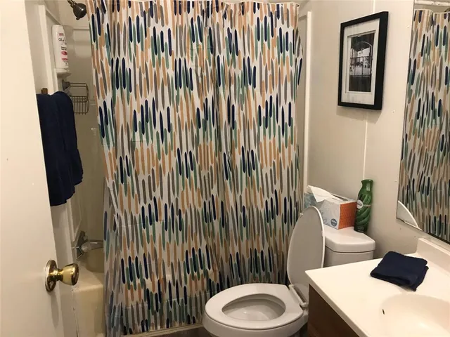 a bathroom with a toilet and a sink