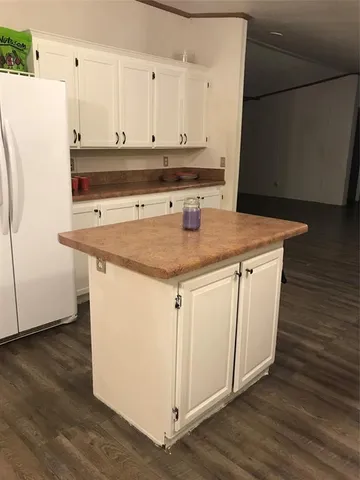 a view of cabinets with wooden floor