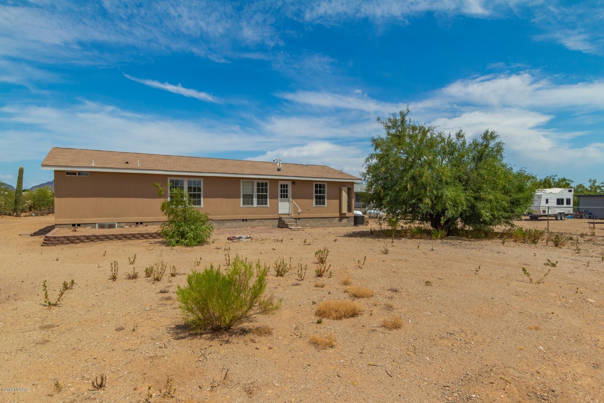 8945 West Bopp Road Tucson, AZ 85735 - Photo 18 of 21 a view of a house with a yard