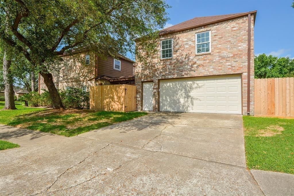 11502 Wickersham Lane Houston, TX 77077 - Photo 21 of 22 a view of a house with a yard
