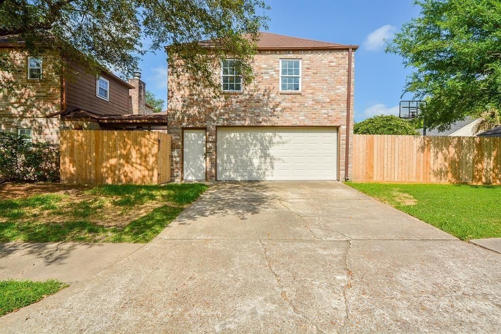 11502 Wickersham Lane Houston, TX 77077 - Photo 22 of 22 a front view of house with yard