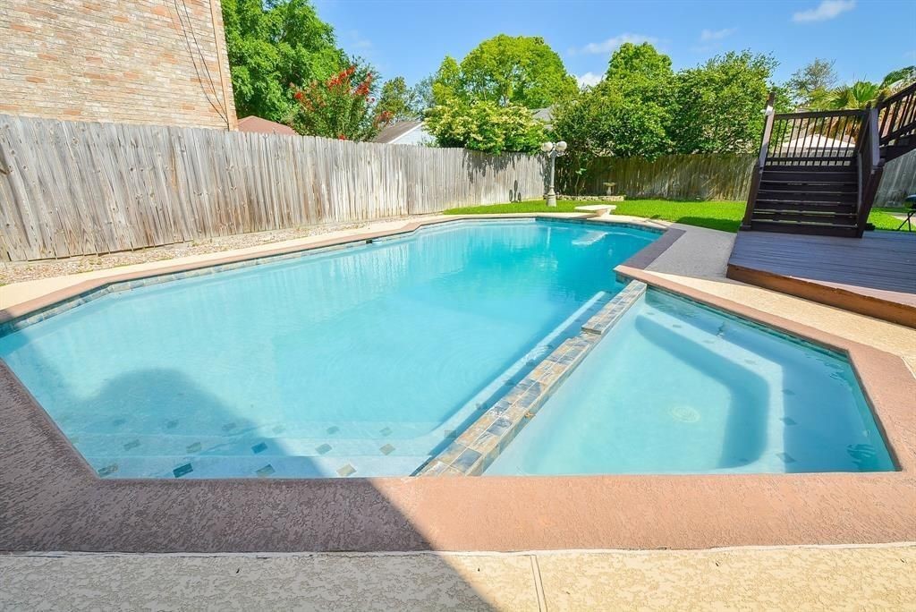 11502 Wickersham Lane Houston, TX 77077 - Photo 5 of 22 a view of a backyard with swimming pool