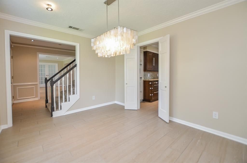 11502 Wickersham Lane Houston, TX 77077 - Photo 7 of 22 a view of an empty room with a window