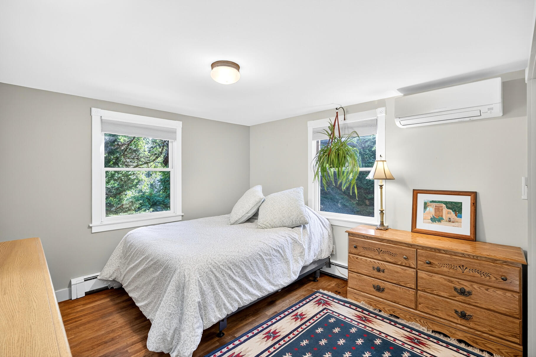 11 Whelpley Road Eastham, MA 02642 - Photo 11 of 37 a bedroom with a bed and a dresser next to a window