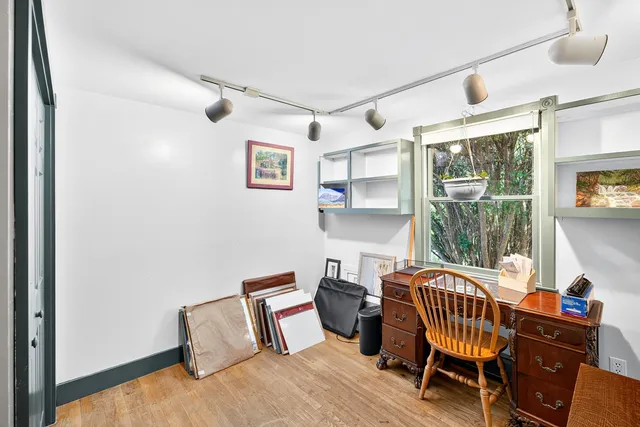 a bedroom with furniture and a window