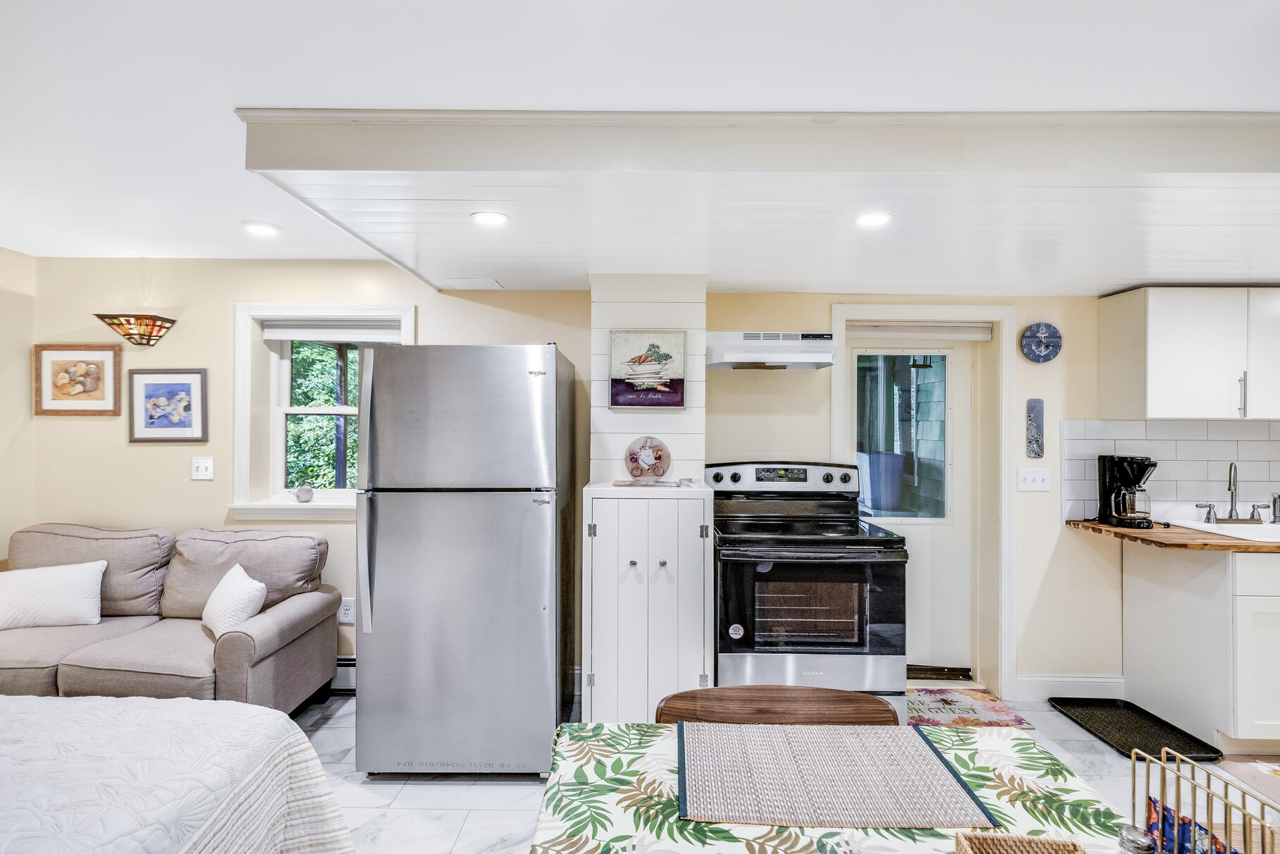 11 Whelpley Road Eastham, MA 02642 - Photo 28 of 37 a kitchen with stainless steel appliances a stove a refrigerator and a fireplace