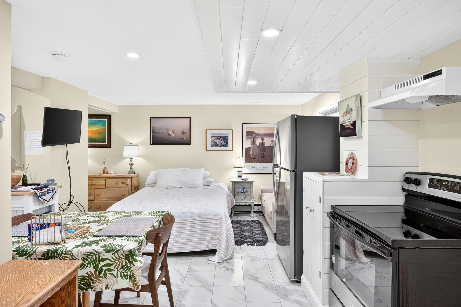 11 Whelpley Road Eastham, MA 02642 - Photo 29 of 37 a living room with furniture a flat screen tv and kitchen view