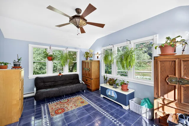 a living room with furniture and a large window