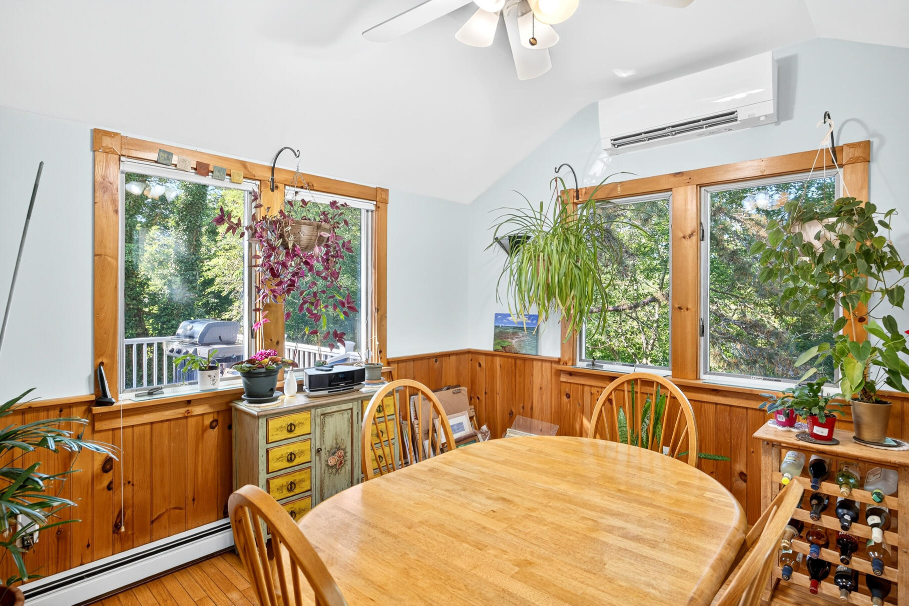 11 Whelpley Road Eastham, MA 02642 - Photo 6 of 37 a bedroom with furniture a large window and a chandelier