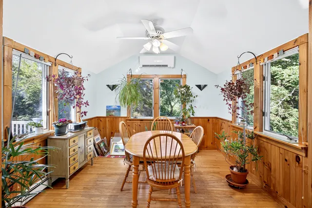 a balcony with furniture and wooden floor