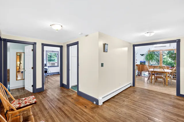 a view of livingroom with furniture and hardwood floor