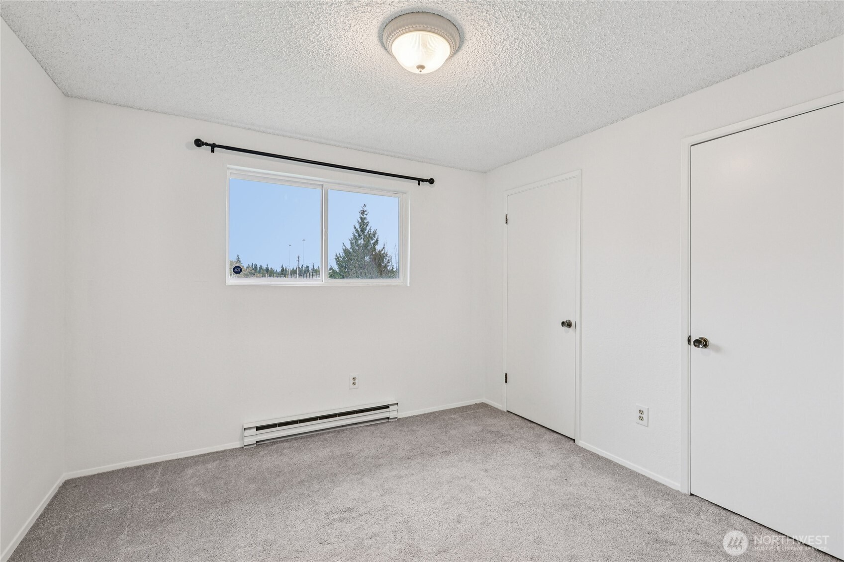 7909 218th Street Southwest, Unit 4 Edmonds, WA 98026 - Photo 21 of 29 a view of an empty room with a window