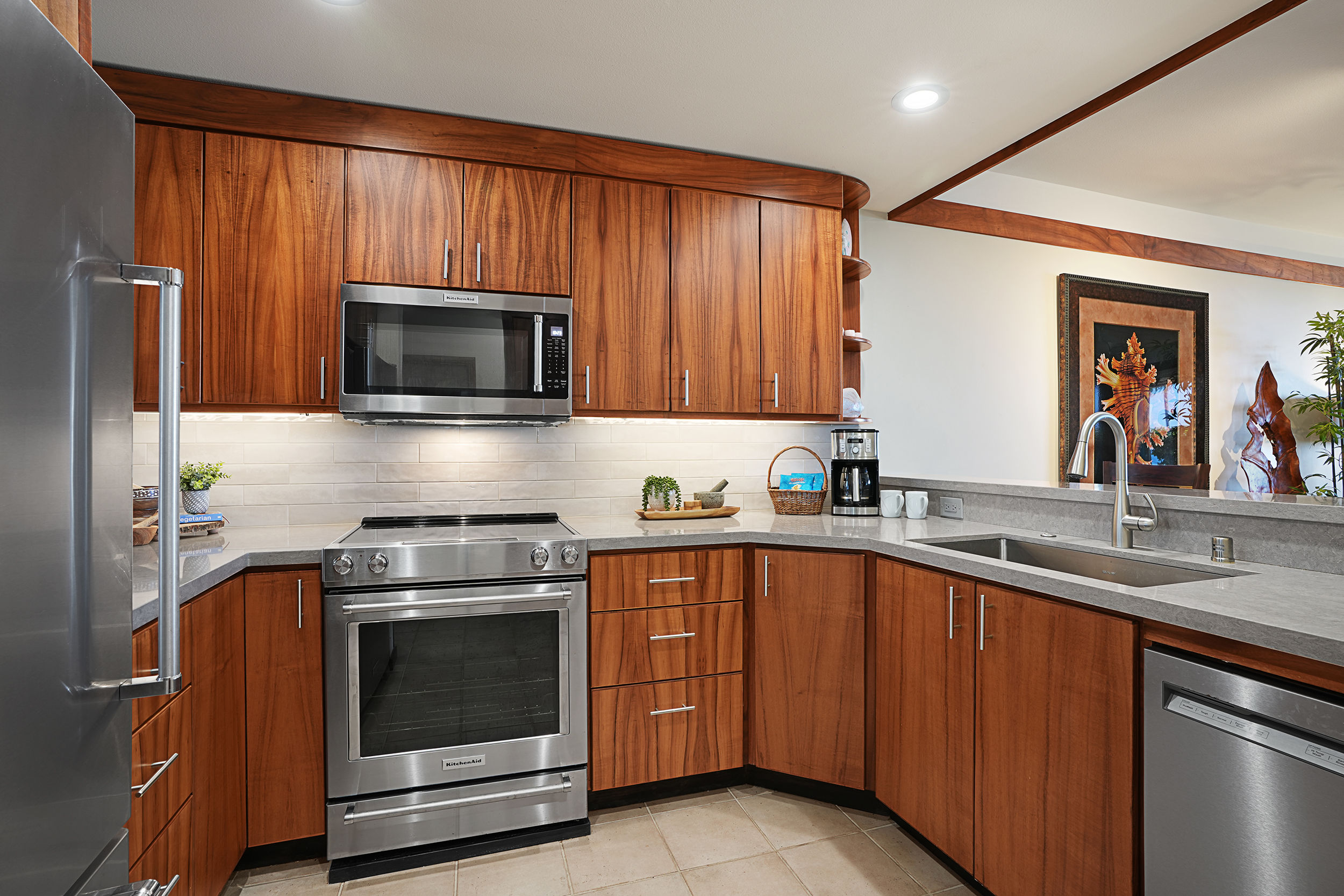 2640 Puuholo Road, Unit 212 Koloa, HI 96756 - Photo 3 of 10 a kitchen with a sink stove and microwave