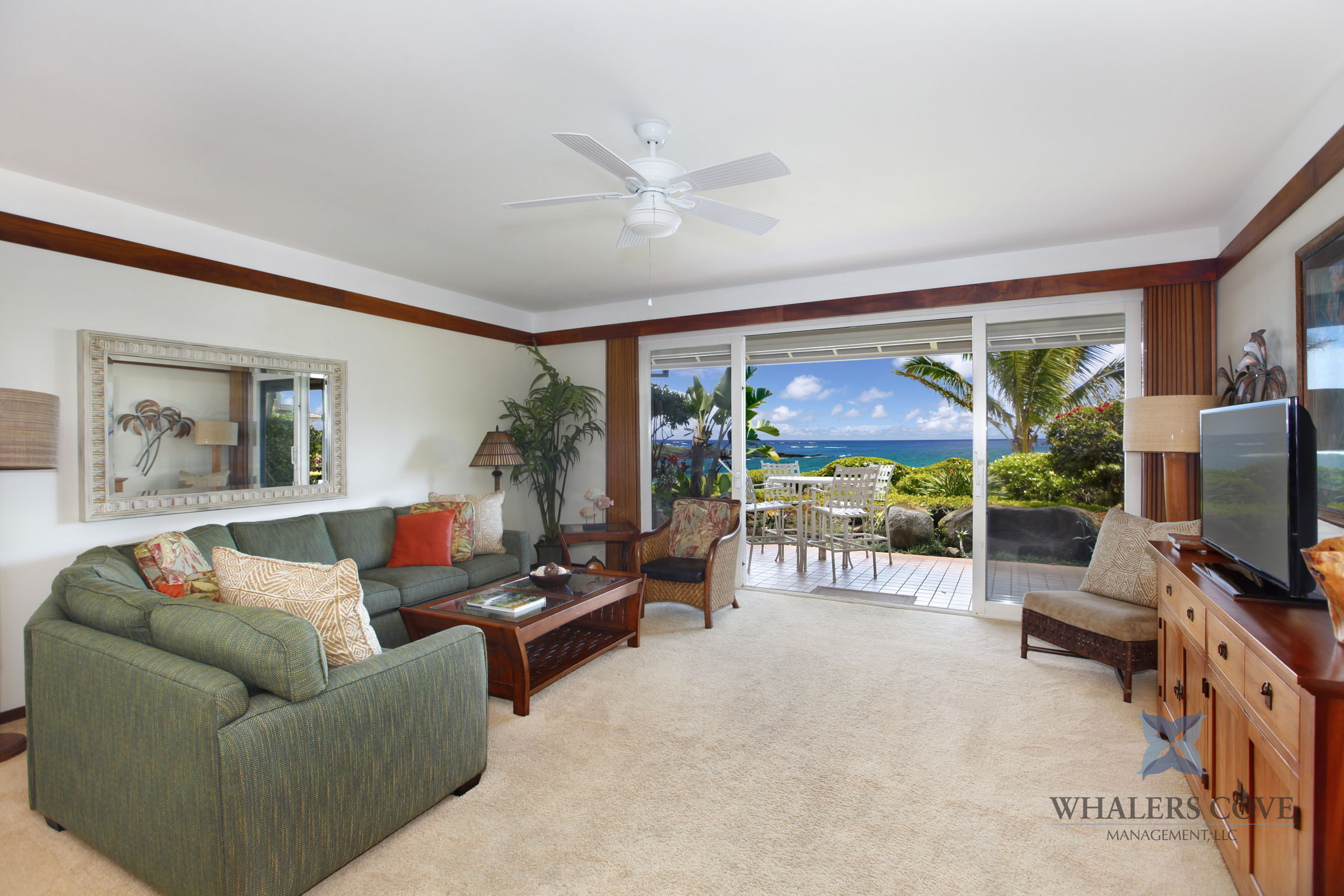 2640 Puuholo Road, Unit 212 Koloa, HI 96756 - Photo 4 of 10 a living room with furniture and a flat screen tv