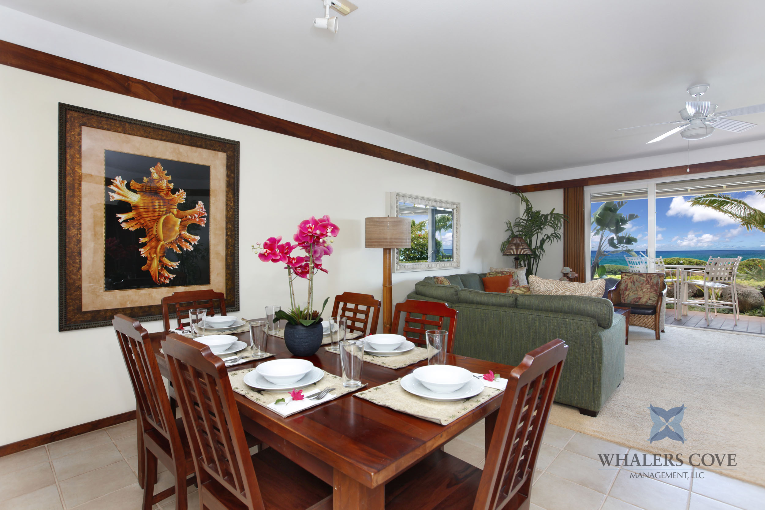 2640 Puuholo Road, Unit 212 Koloa, HI 96756 - Photo 6 of 10 a view of a dining room with furniture large windows and a chandelier