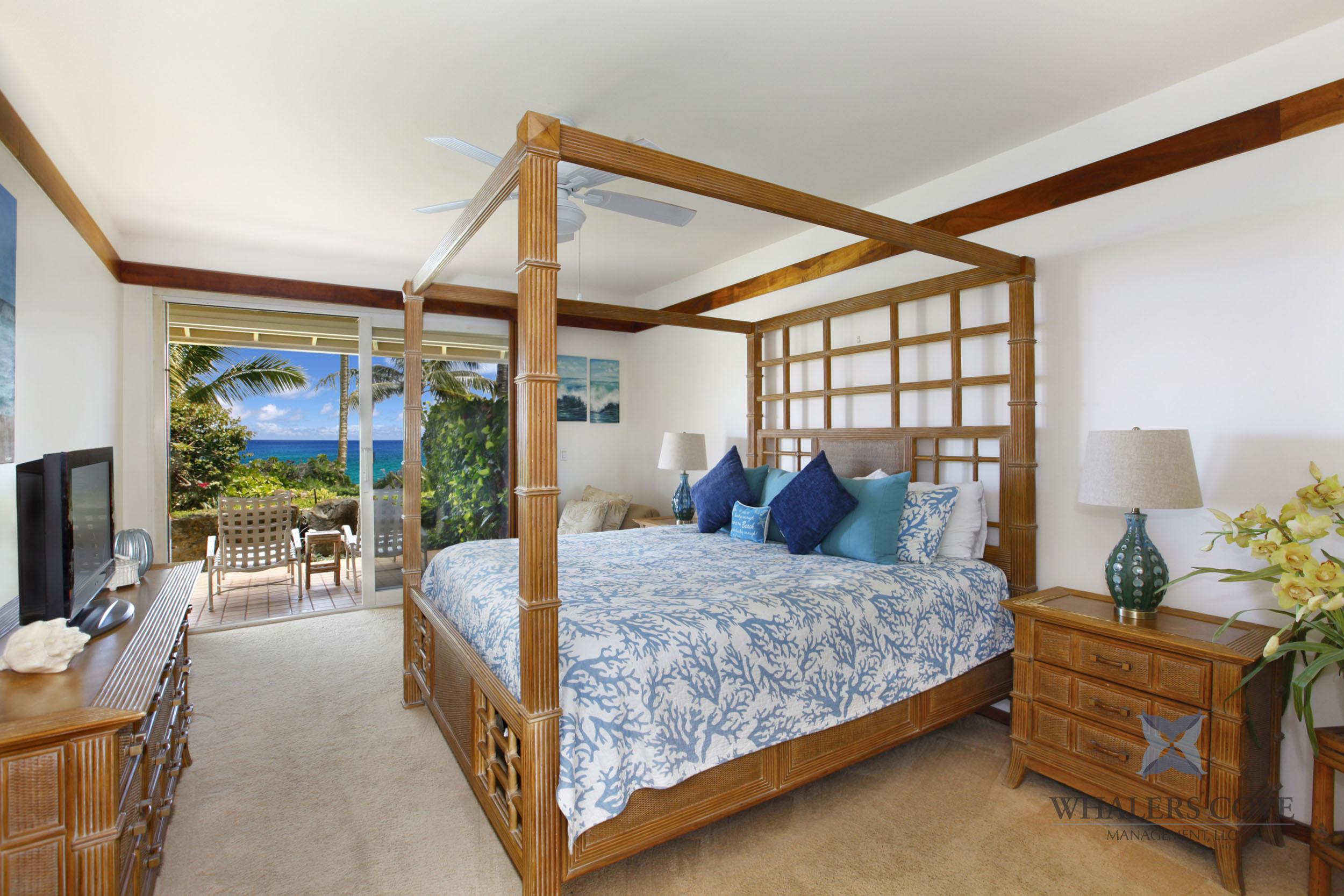 2640 Puuholo Road, Unit 212 Koloa, HI 96756 - Photo 7 of 10 a bedroom with a bed and large windows