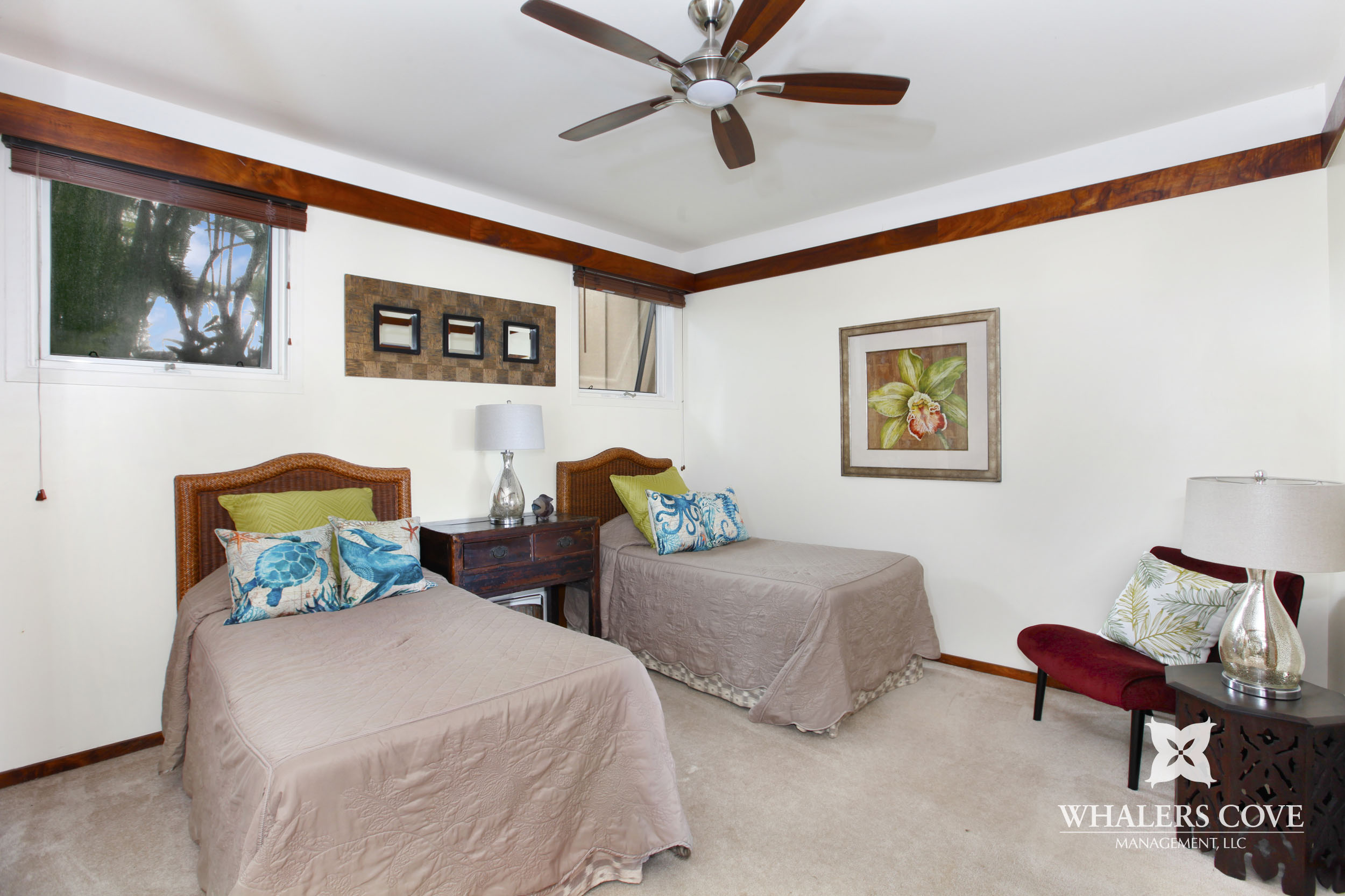 2640 Puuholo Road, Unit 212 Koloa, HI 96756 - Photo 9 of 10 a bedroom with two beds and painting on the wall