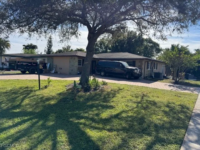 a view of a backyard with a small pool