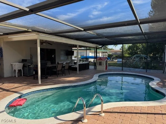 a view of a swimming pool with a patio