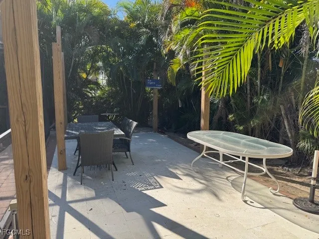 a view of a tables and chairs in patio