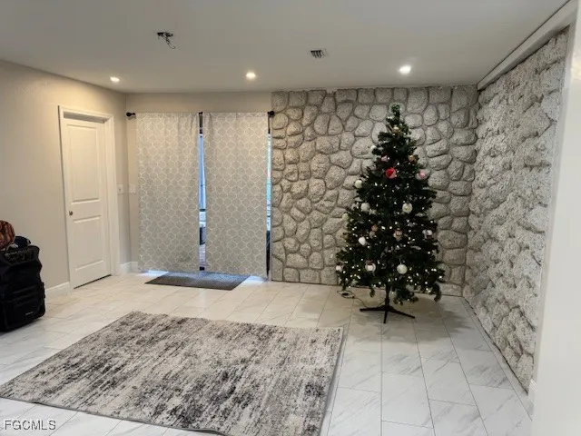 a view of entryway with a flower pot and a rug