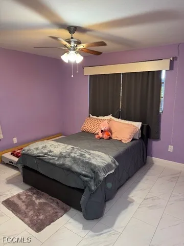 a bedroom with a bed and a closet