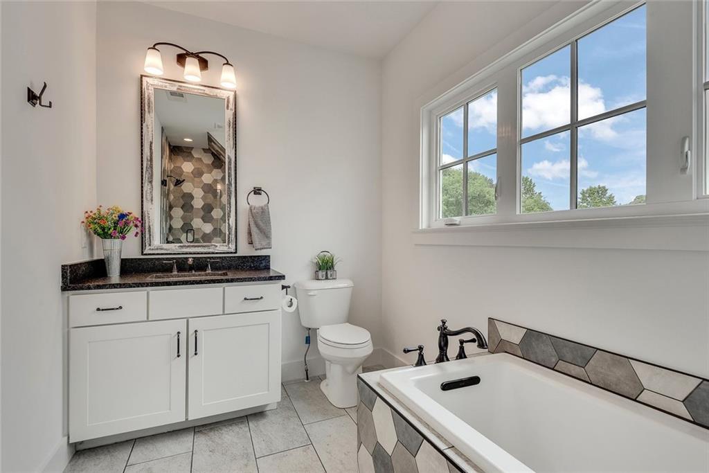 2503 Sugar Pike Road Canton, GA 30115 - Photo 110 of 134 a bathroom with a sink and a toilet