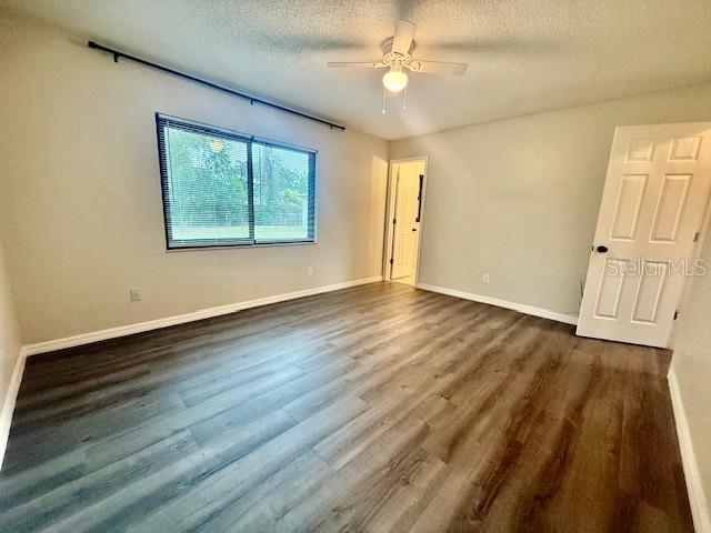 1819 Oak Street DeLand, FL 32724 - Photo 11 of 26 a view of an empty room with wooden floor and a window