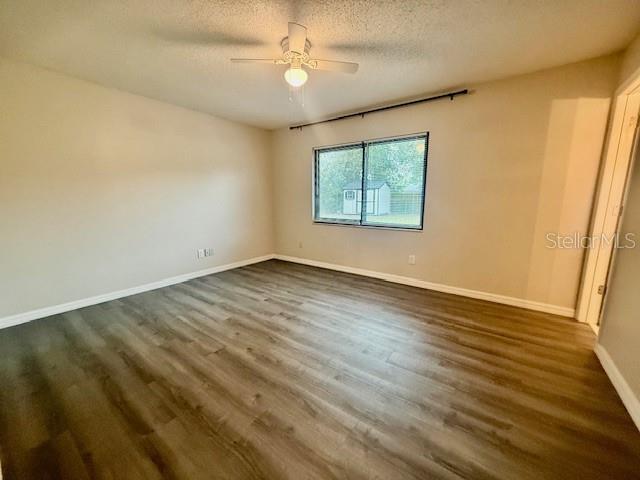 1819 Oak Street DeLand, FL 32724 - Photo 12 of 26 a view of an empty room with wooden floor and a window