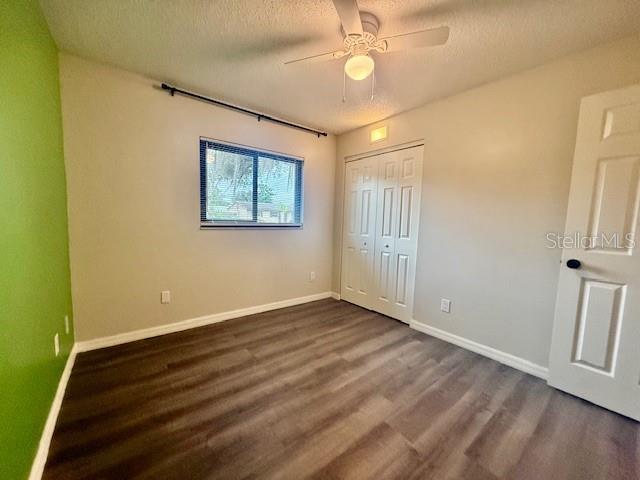 1819 Oak Street DeLand, FL 32724 - Photo 15 of 26 a view of an empty room with wooden floor and a window