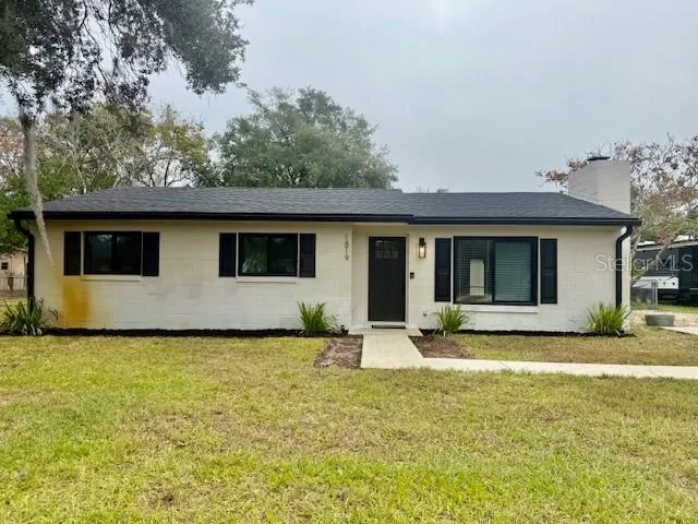 a house that has a big yard in front of it