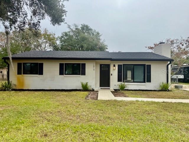 1819 Oak Street DeLand, FL 32724 - Photo 2 of 26 a house that has a big yard in front of it