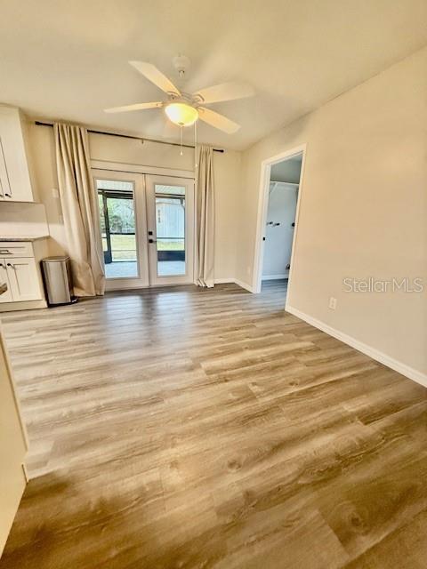 1819 Oak Street DeLand, FL 32724 - Photo 5 of 26 a view of an empty room with window and wooden floor