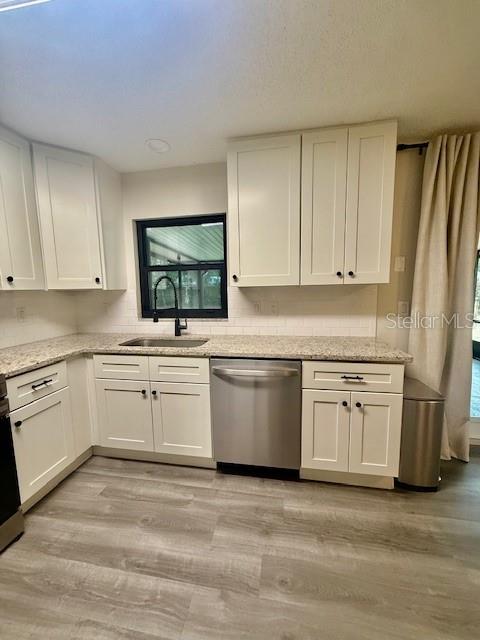 1819 Oak Street DeLand, FL 32724 - Photo 9 of 26 a kitchen with appliances cabinets and a sink