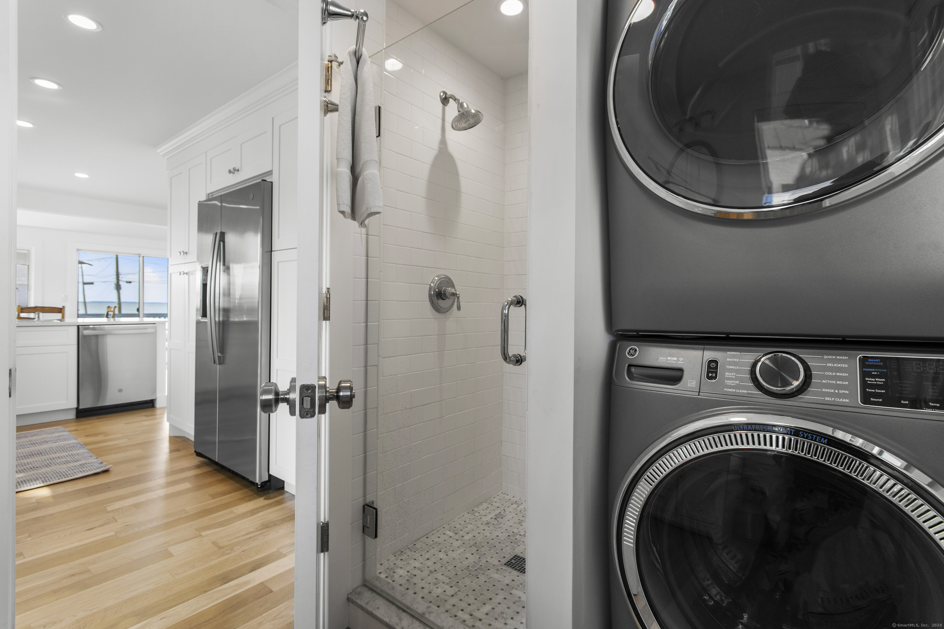 15 Cottage Road Old Lyme, CT 06371 - Photo 14 of 26 a utility room with wooden floor washer and dryer