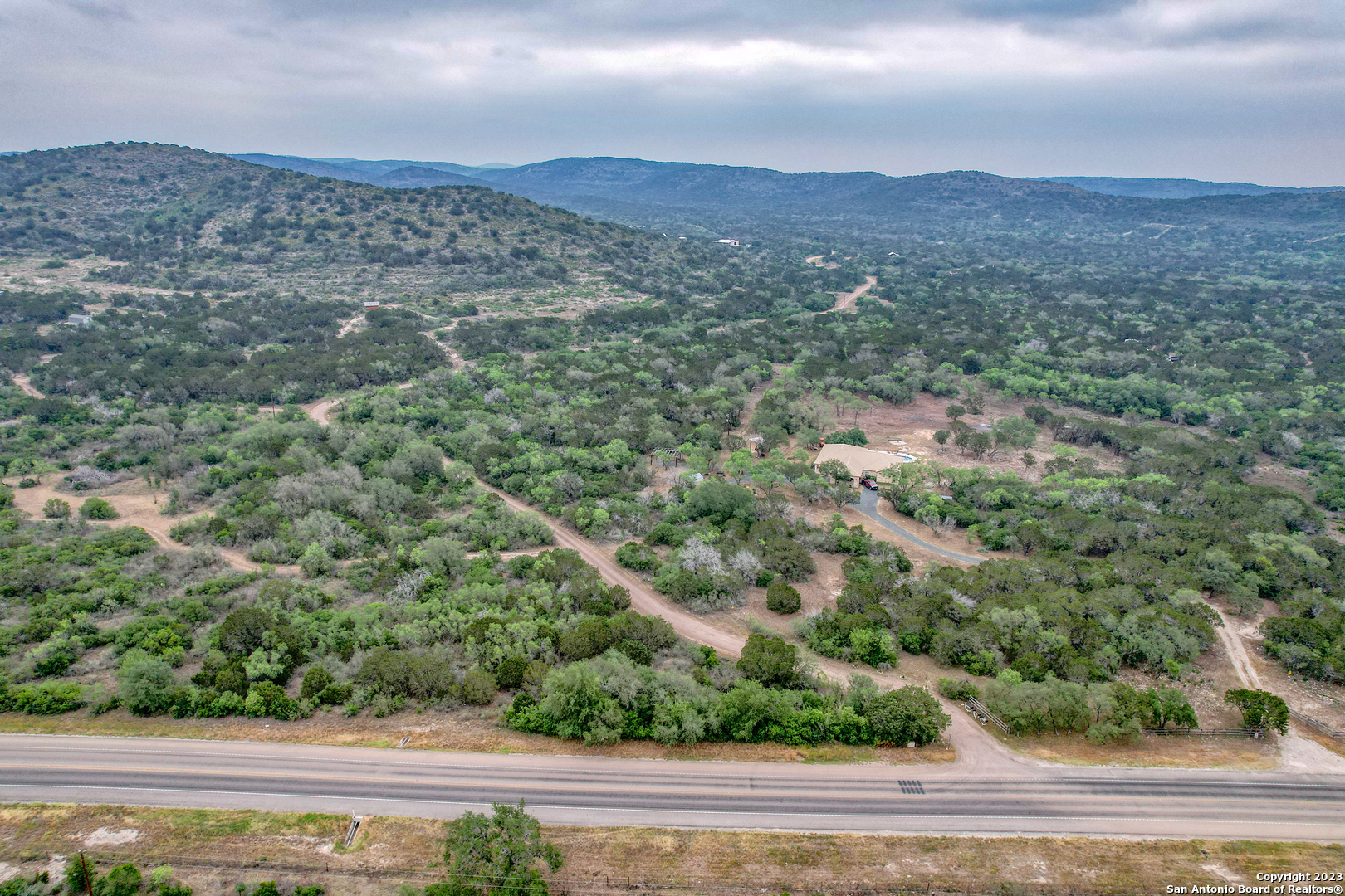 0 Brushy Creek Ranch Road Concan, TX 78838 - Photo 3 of 27 an aerial view of houses with yard