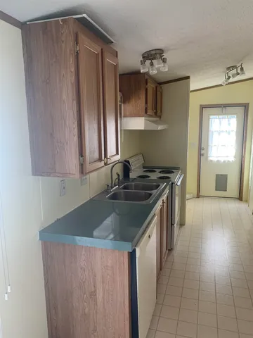 a bench sitting in backyard of house