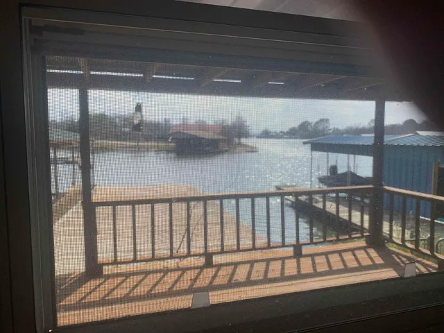 a view of a porch with a wooden floor